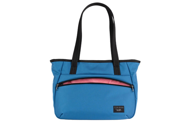 Photo of the Nomad Tote in Constellation Ballistic with Sakura (pale pink with white grid) 200 Halcyon interior.